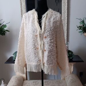 Elegant Cream Cardigan with Fringe Details